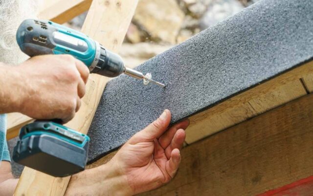 homeowner doing diy roof repair after spotting urgent damages