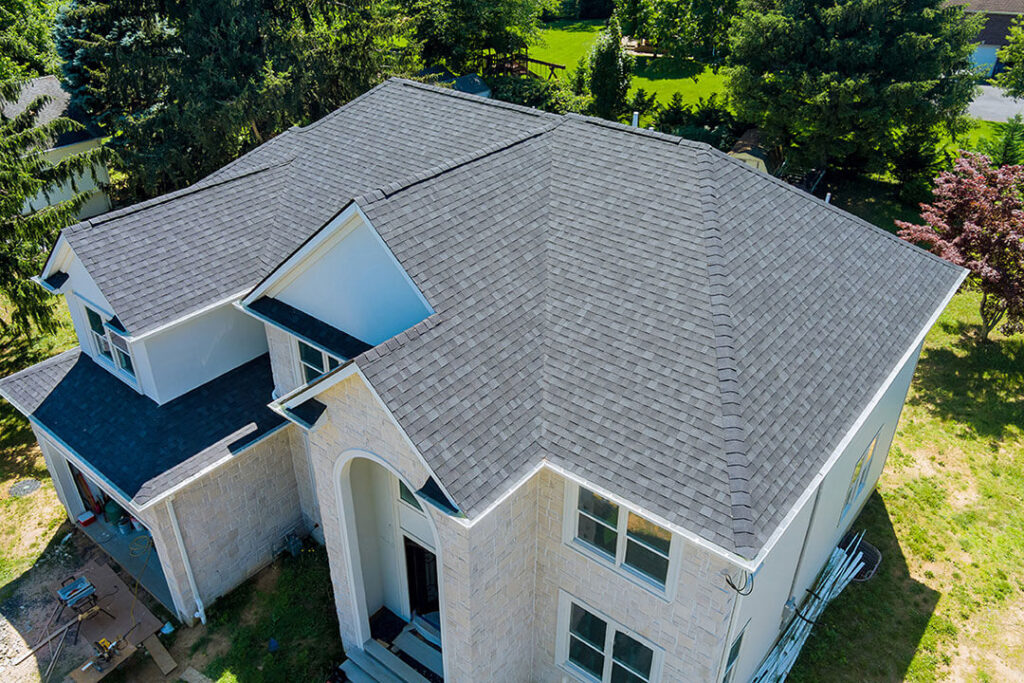 2 story building with new shingle roof installed by roofing contractor Kansas city