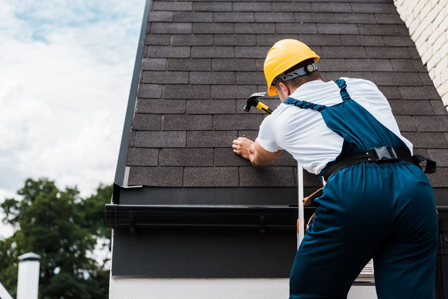 roofer replacing roof at the best time for customer